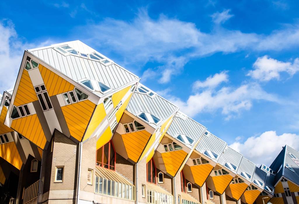 A row of yellow cubes that make up the unique attic rooms and roofs of the Cube Houses of Rotterdam