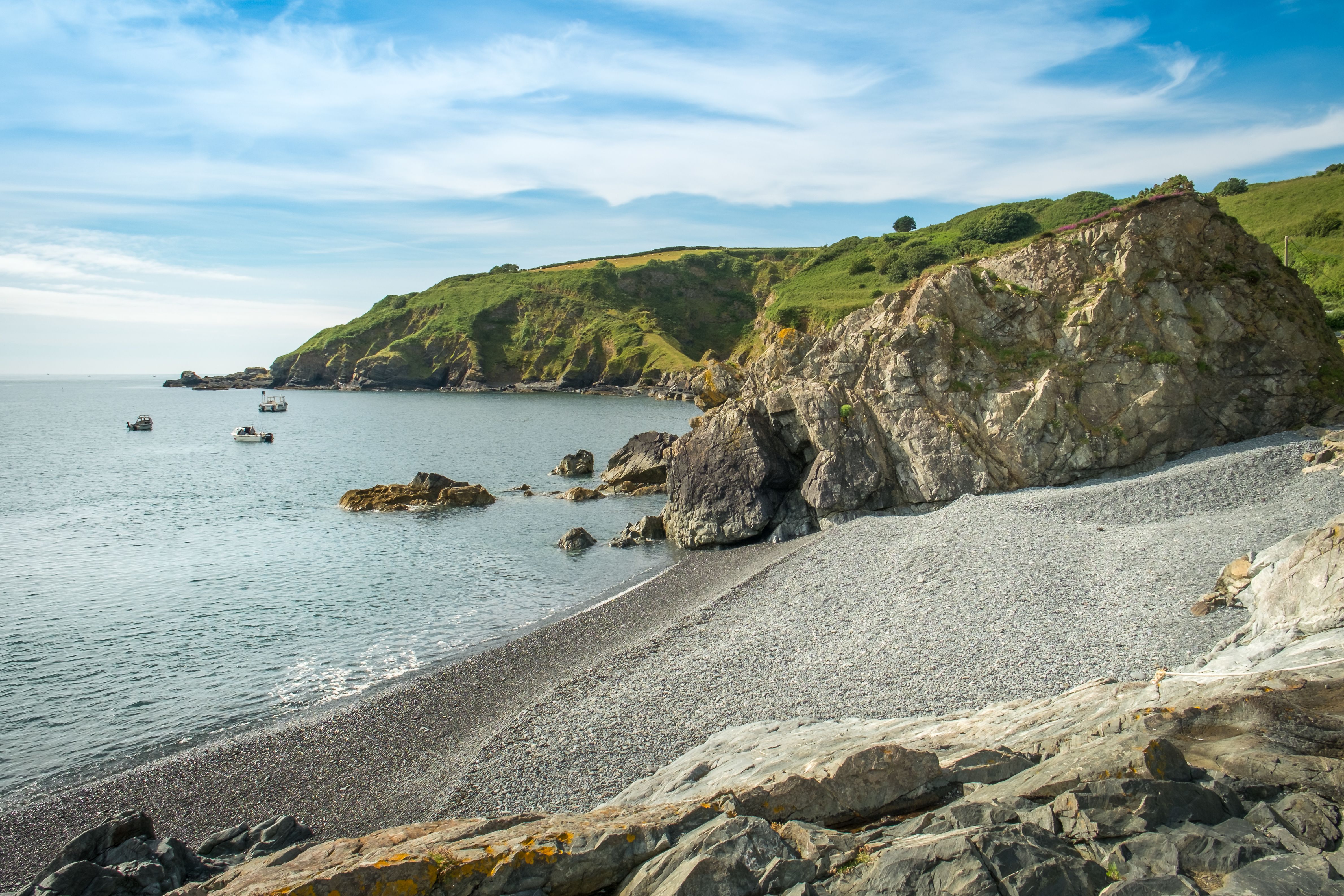 The pebbly Porthkerris Beach on the east of the Lizard peninsula in Cornwall.