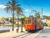 A picture of the famous orange tram that runs from Soller to Port de Soller in Majorca, Spain