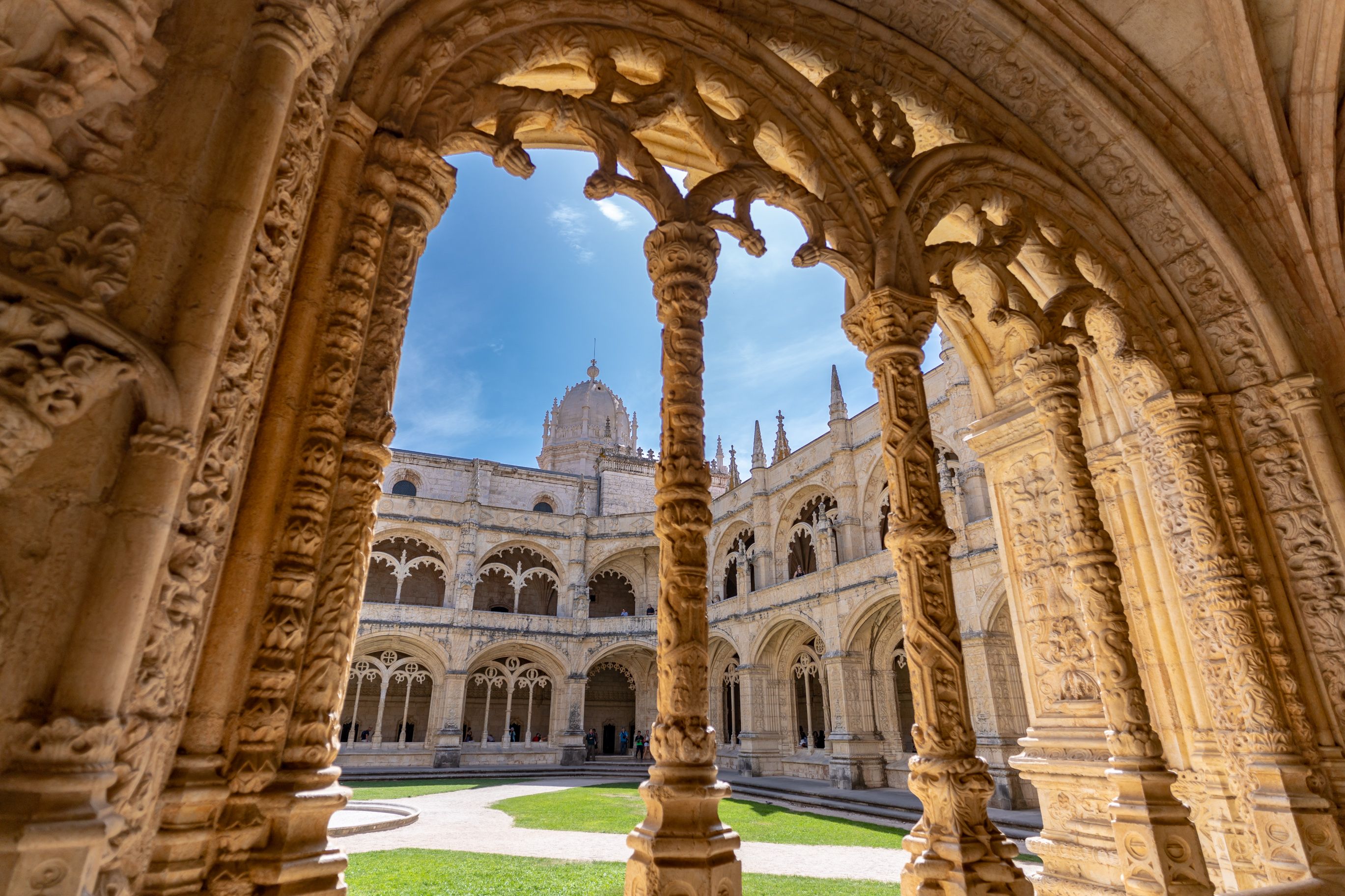 A view through an archway of the courtyard inside Jeronimos Monastery, located in the district of Belem in Lisbon