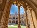 A view through an archway of the courtyard inside Jeronimos Monastery, located in the district of Belem in Lisbon