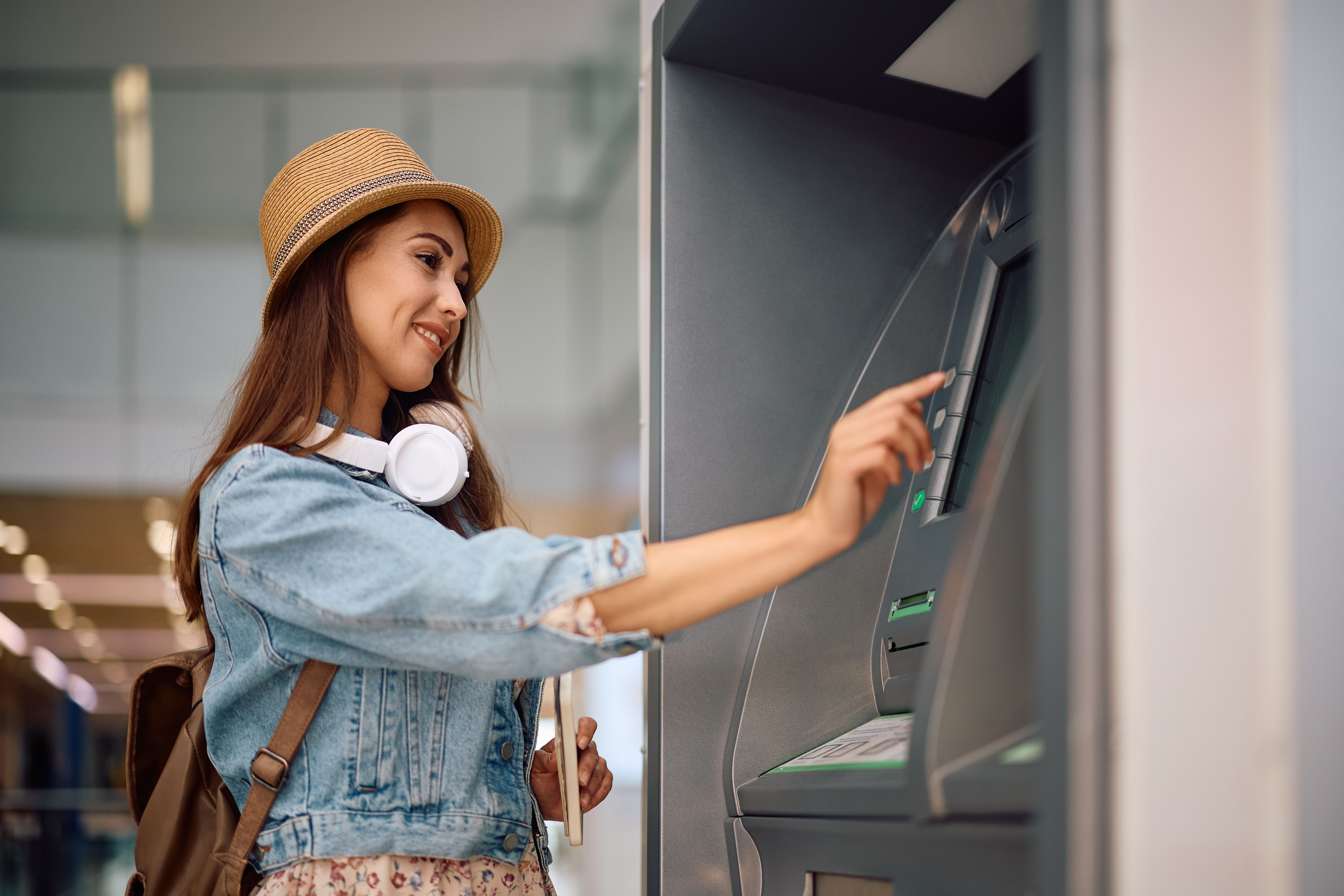 Woman using an ATM machine