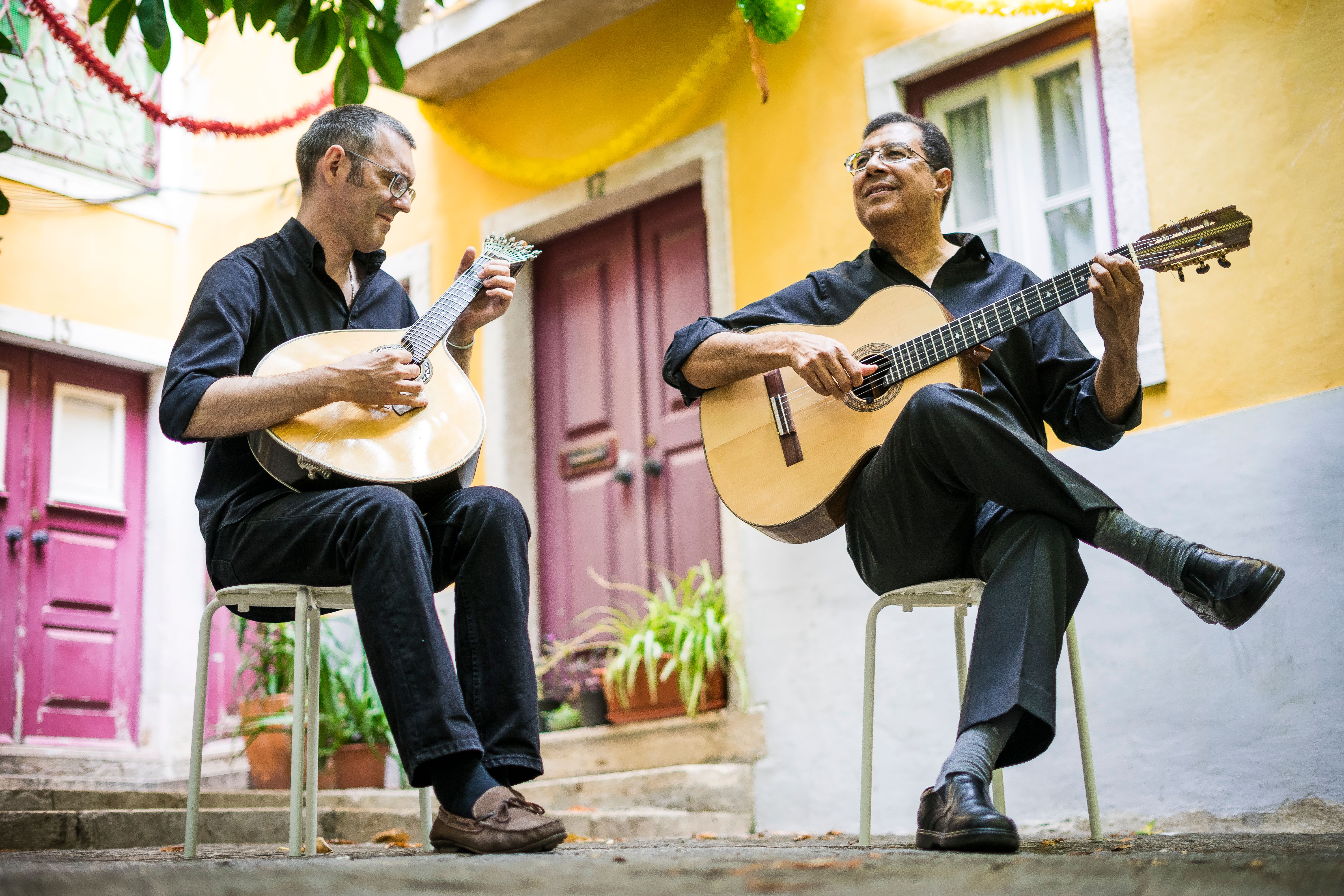 Two fado music players with guitars in Portugal