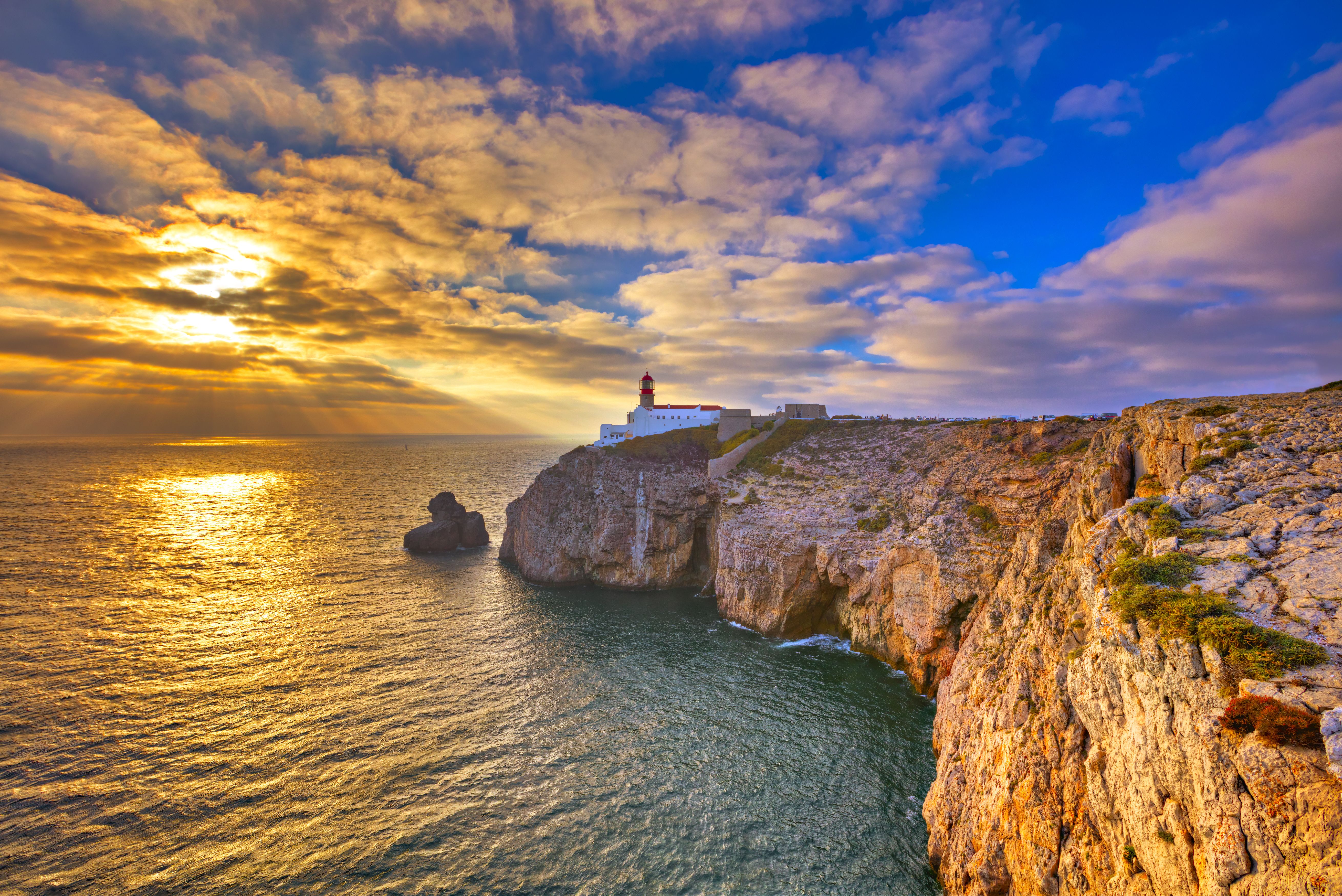 A sunset view of Cabo de Sao Vicente lighthouse in the Algarve, Portugal