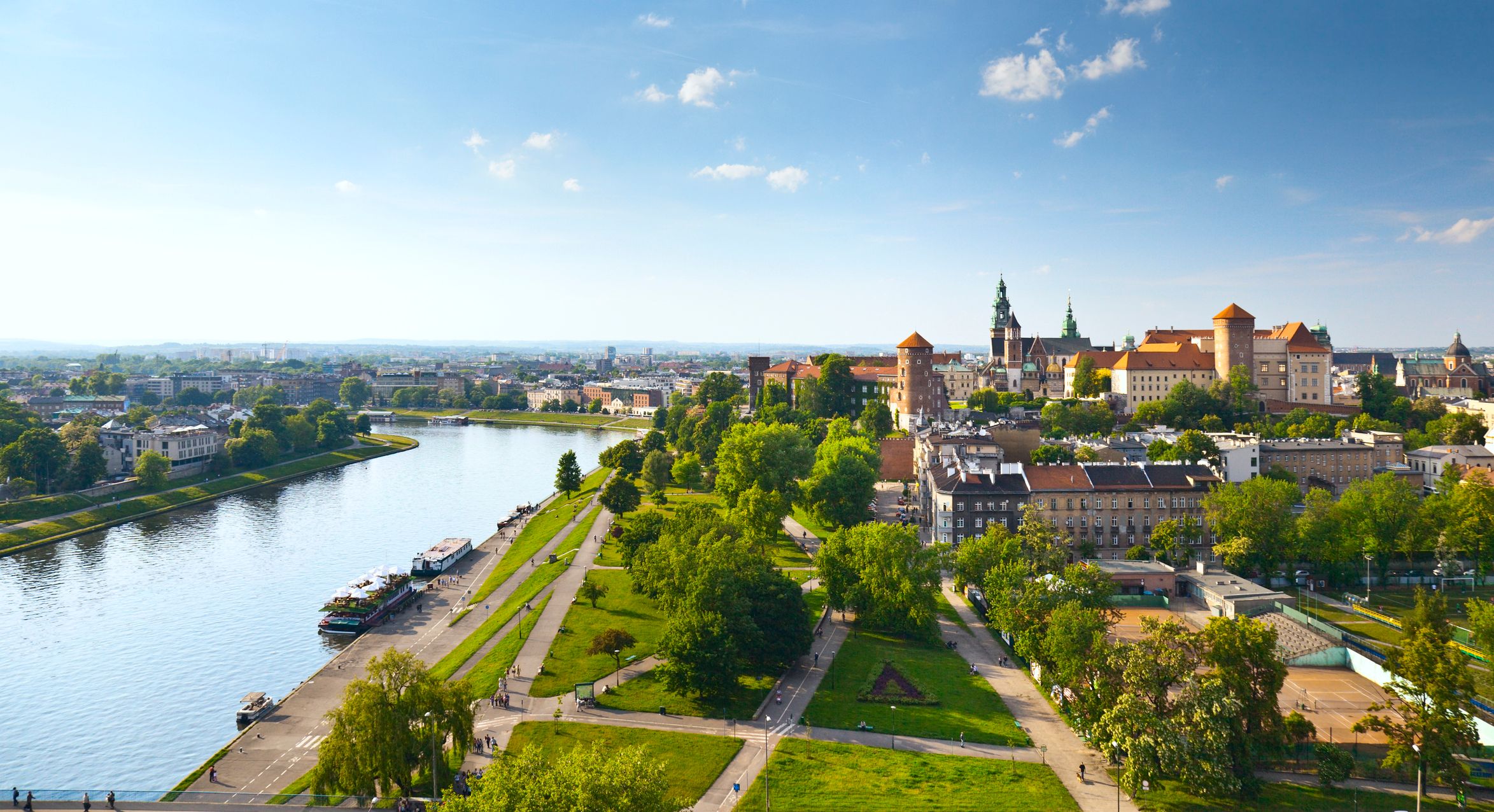 Daytime panorama of Krakow, Poland, featuring Wawel Castle.