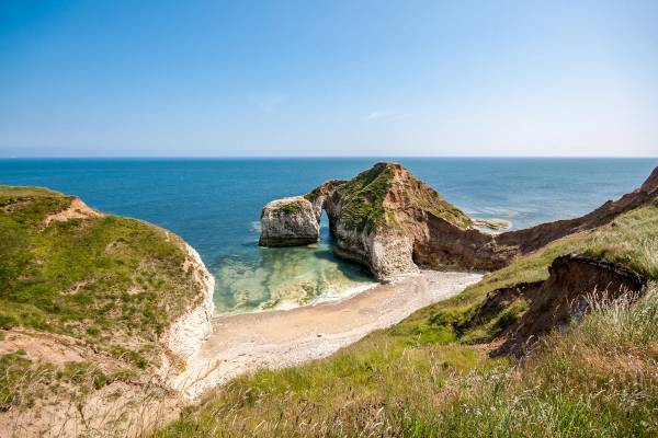 View of the chalk arch formations at Selwick Bay beach in Yorkshire, England on a sunny day