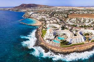 Aerial drone panoramic view of Playa Blanca resort in Lanzarote