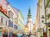 A close up view of an alley with stores and restaurants in old town Bratislava, Slovakia.