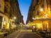 Maqueda Street with outdoor restaurant tables at night time in Palermo, Sicily