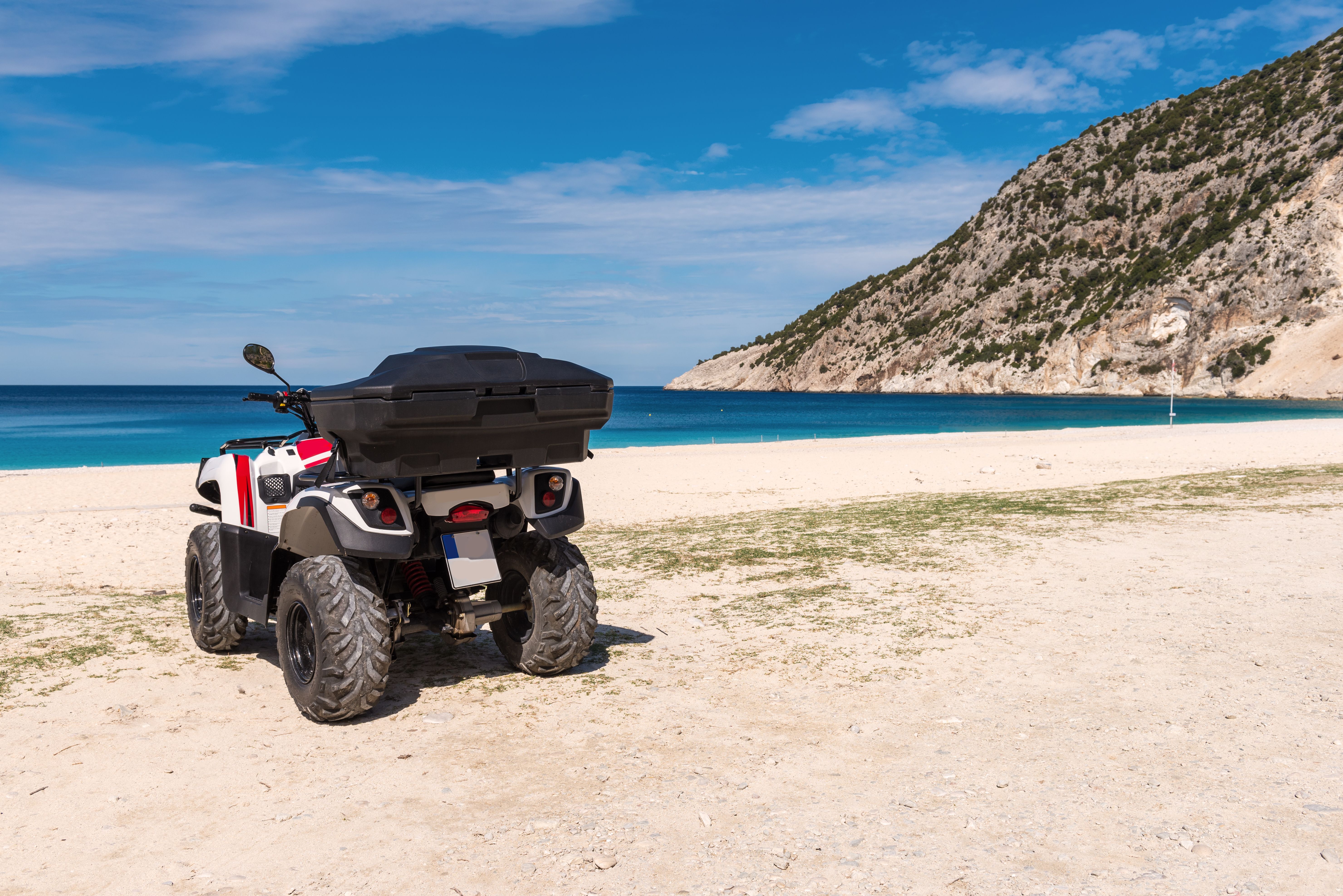 Quad bike parked on the beach of Myrtos in Kefalonia
