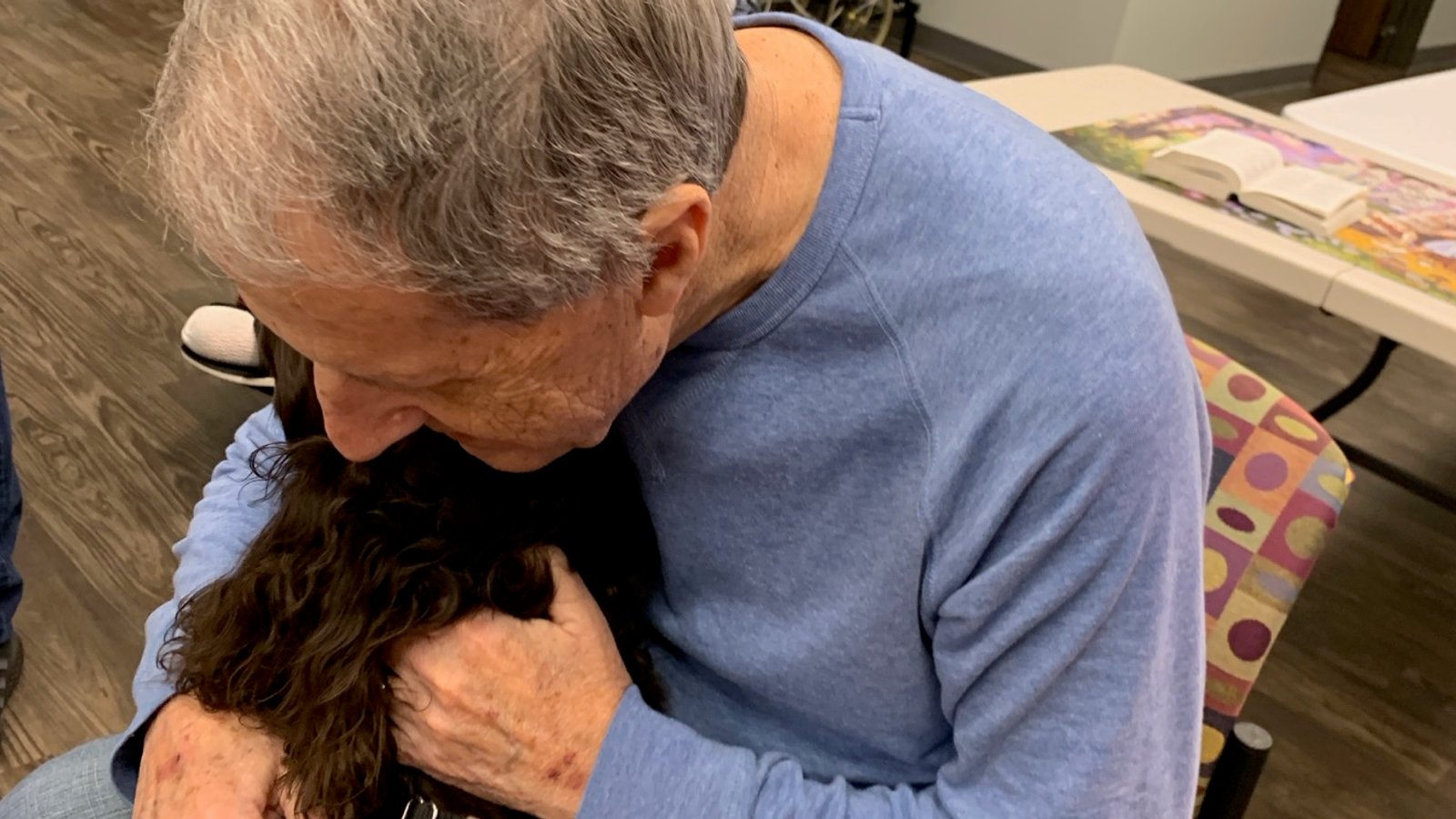 Covey, an Angel Paws therapy dog who serves in assisted living and community care visits.