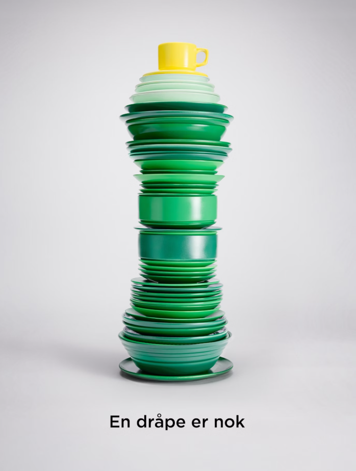 A bottle of the dishwasher liquid Zalo. Green bottle with yellow top