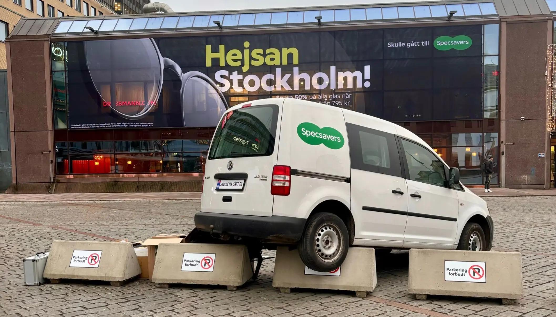 Car misplaced in front of sign with wrong copy