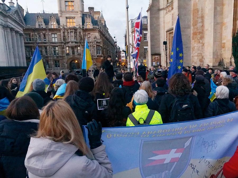 People with Ukrainian flags at the 24 February demonstration on King's Parade, Cambridge