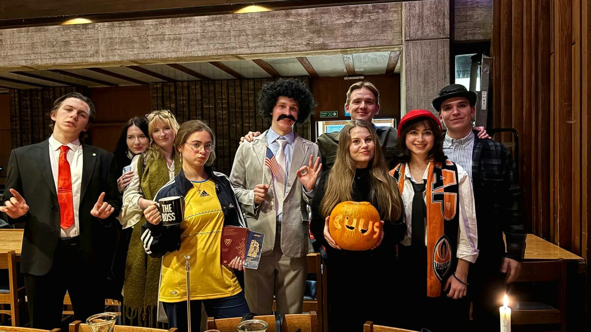 CUUS members in costume at the Halloween social, with a carved CUUS pumpkin