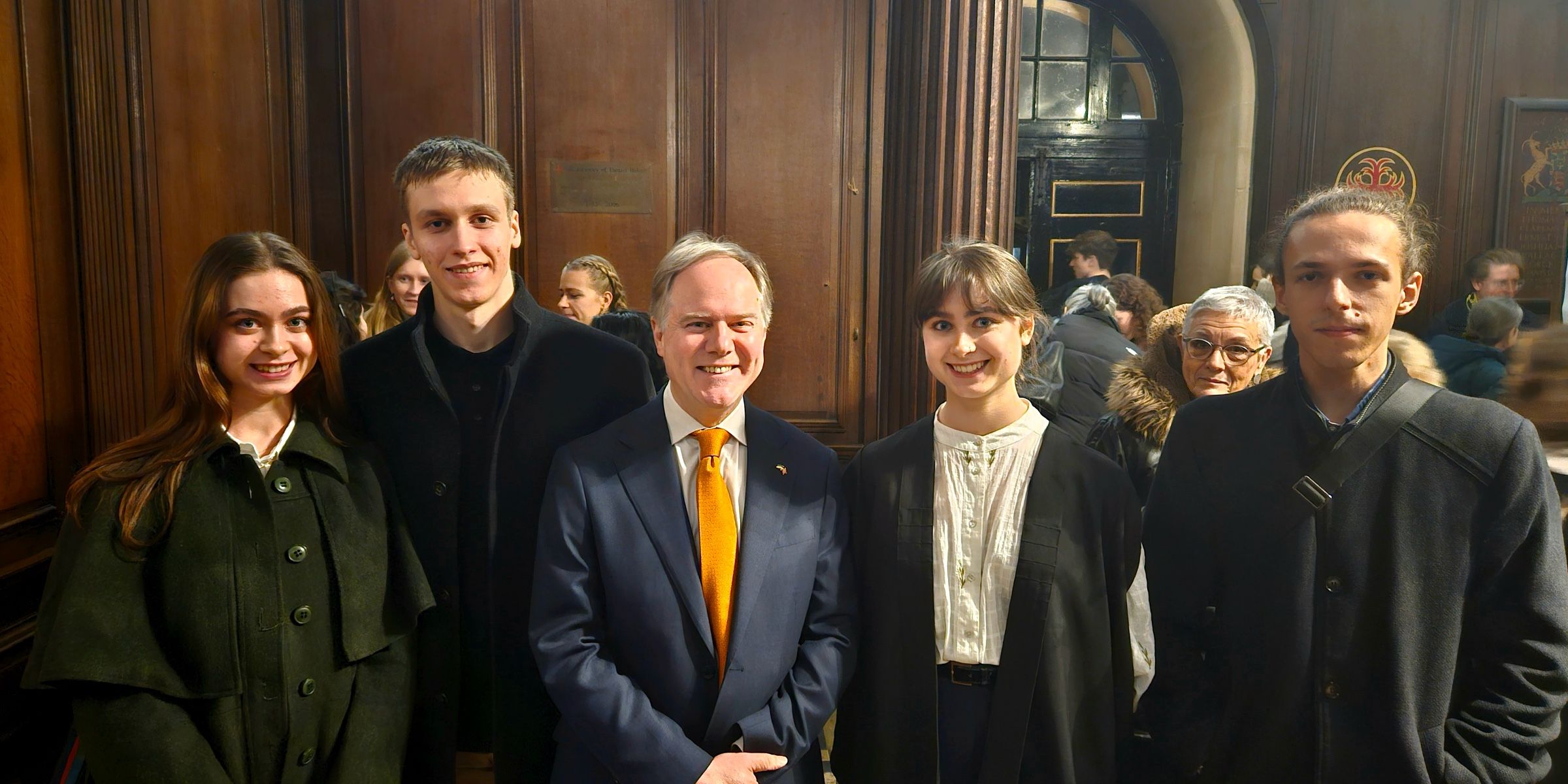 CUUS members with Mr Harris in an oak-panelled hall