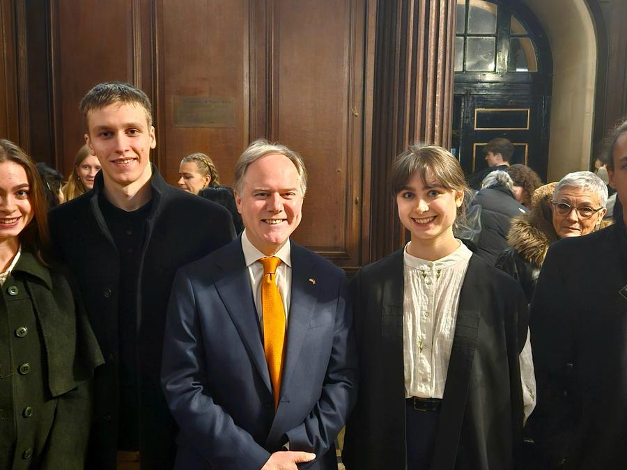 CUUS members with Mr Harris in an oak-panelled hall