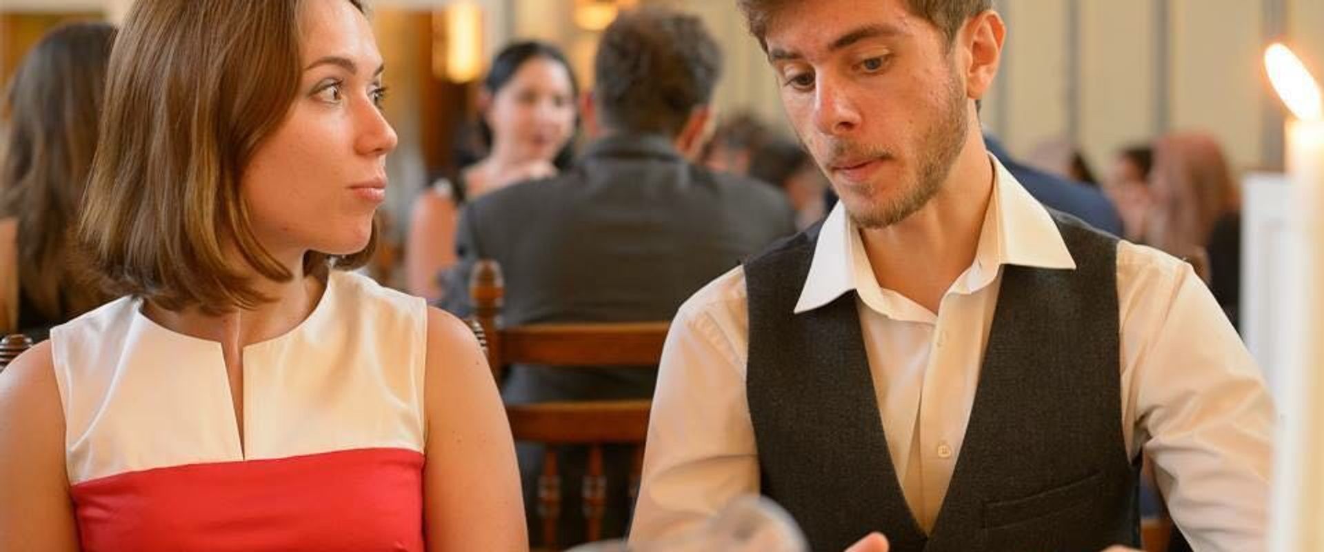 Two CUUS committee members in conversation at a formal dinner