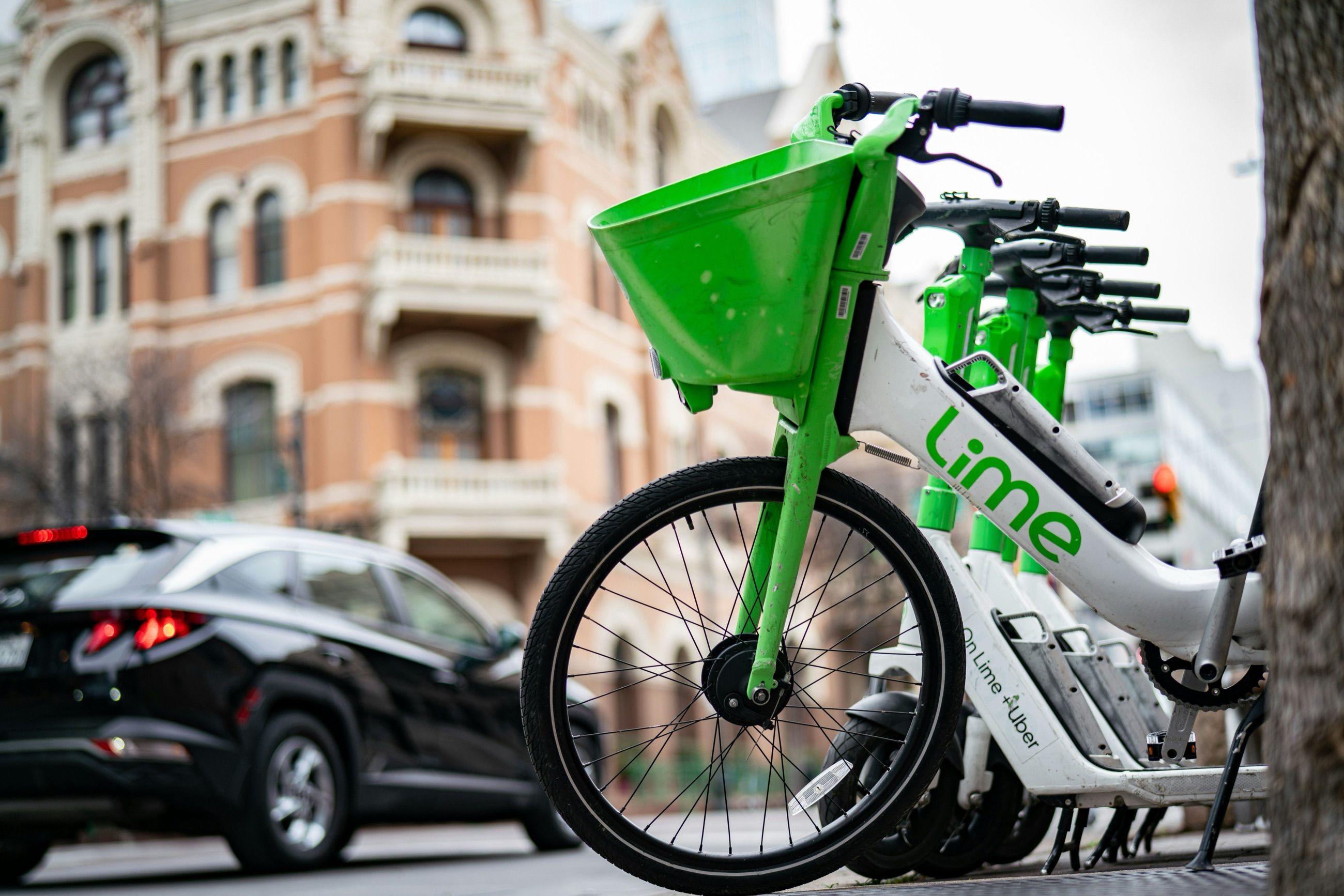 A shared Lime e-bike parked on a city street