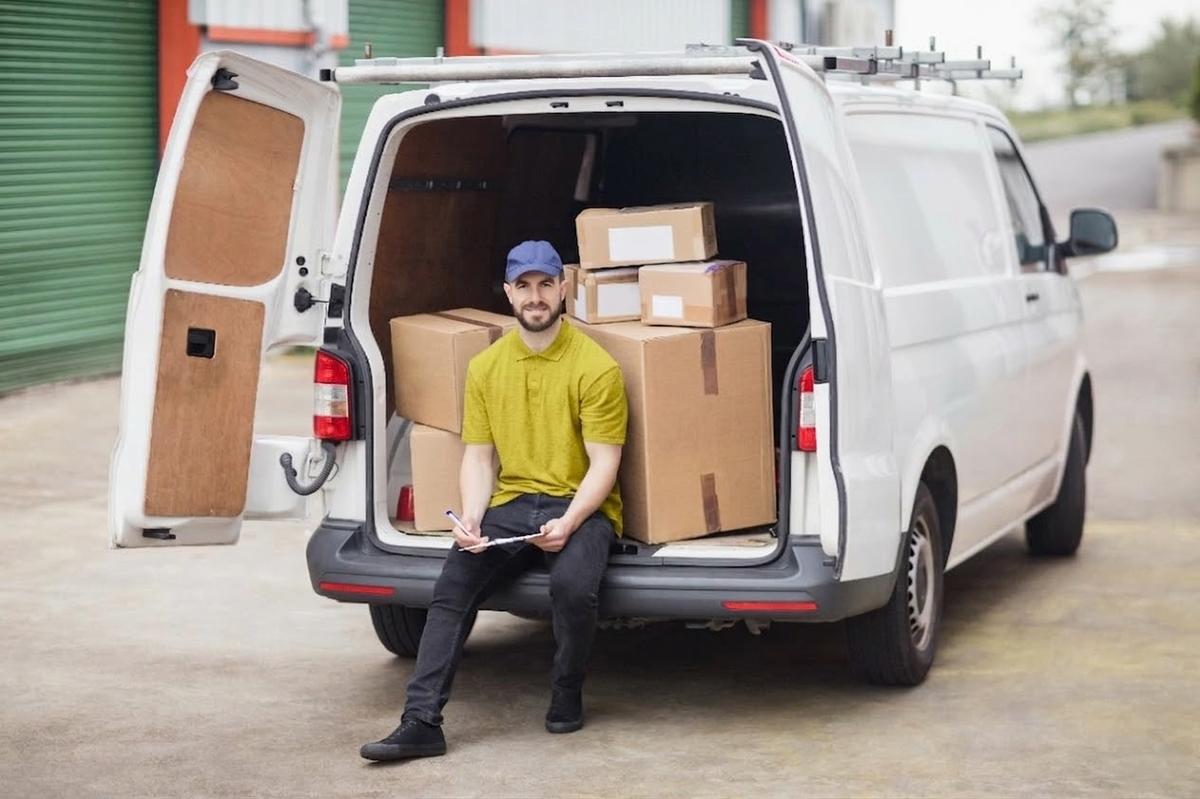 A last mile delivery driver prepares for the day's routes.