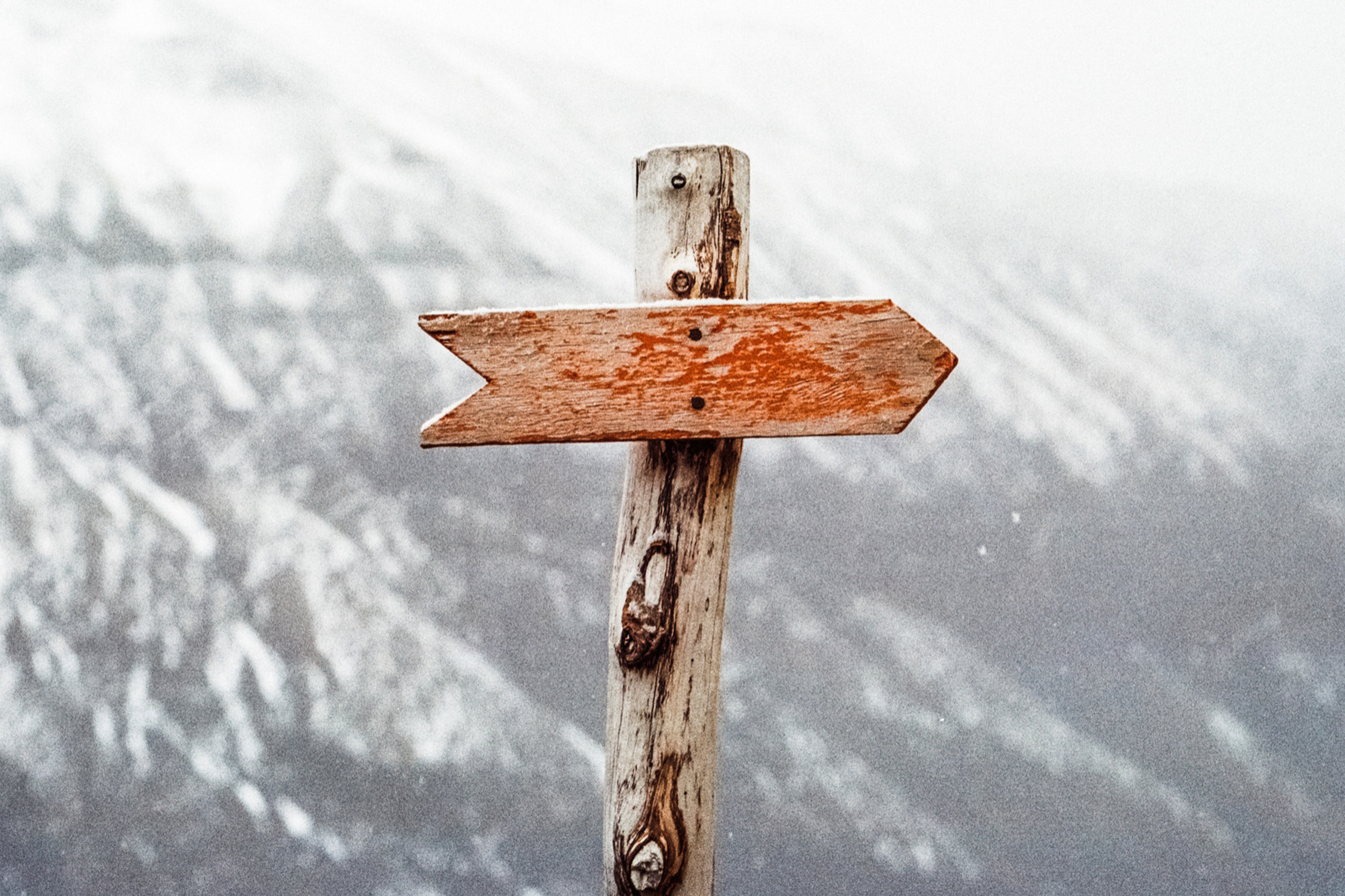 Image showing an arrow directional sign on a mountain range.