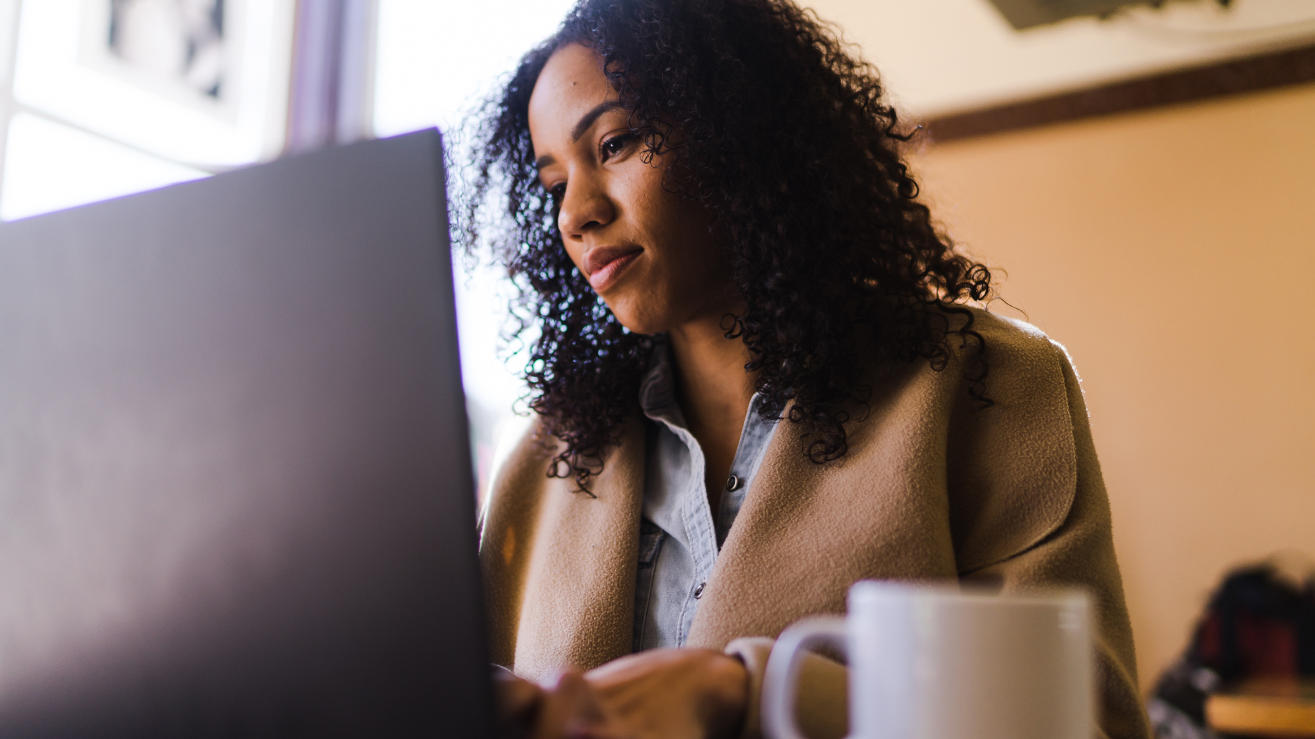 Photo of a person using their laptop.