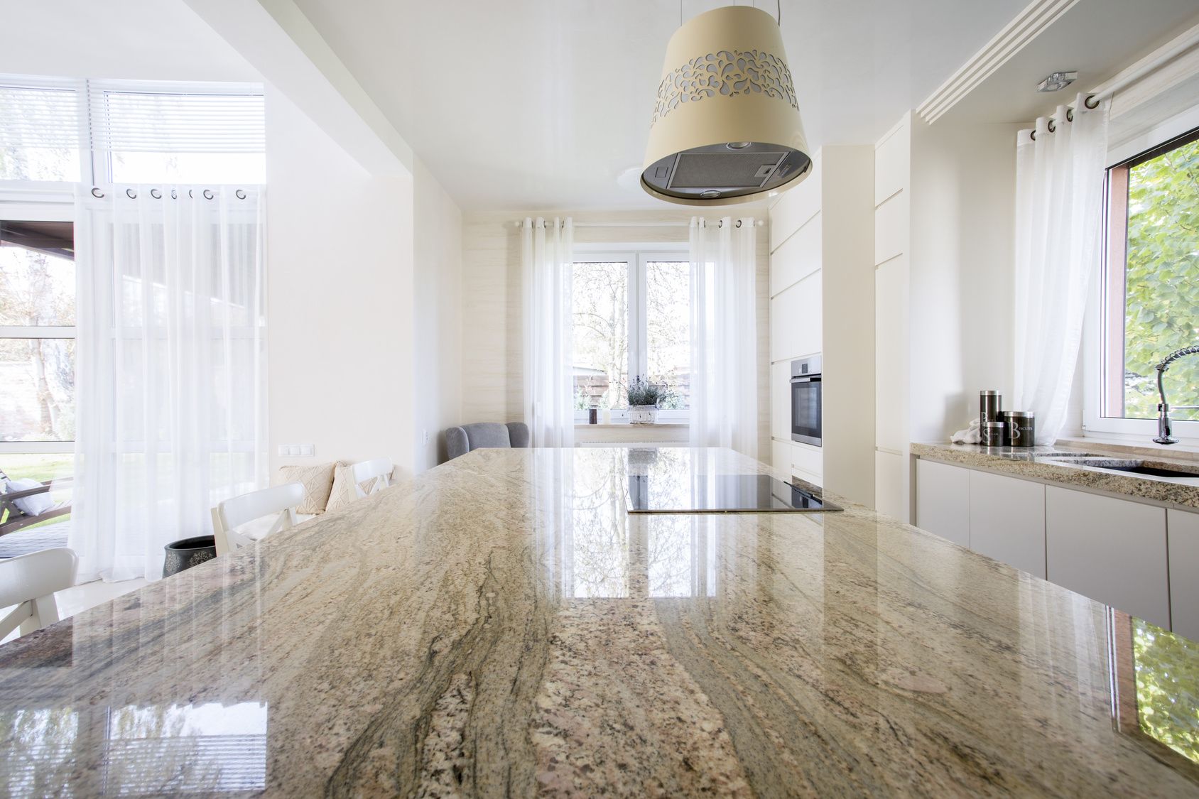Granite worktop inside white light apartment