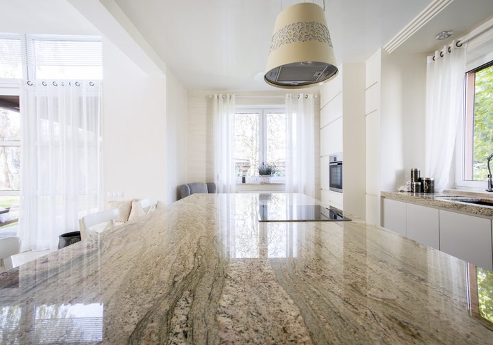 Granite worktop inside white light apartment