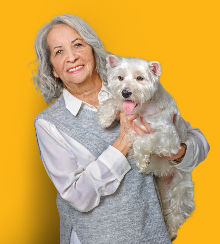Resident smiling with dog