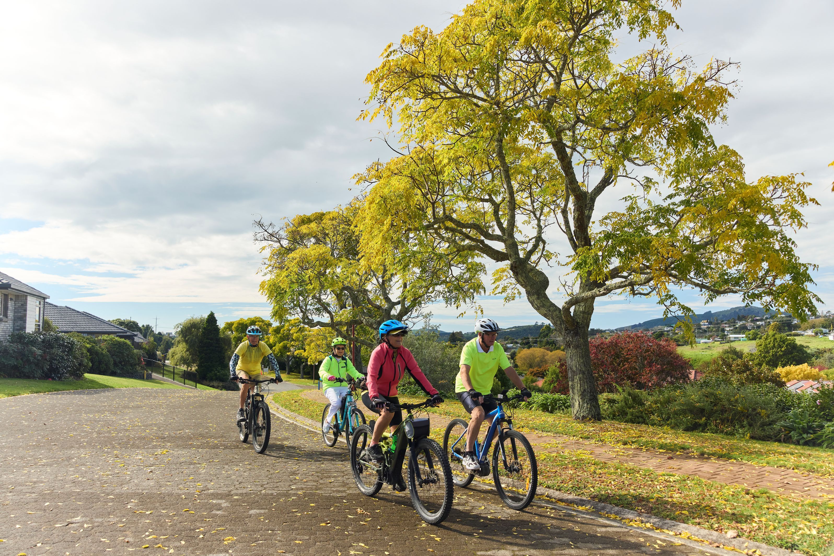 Residents riding their bikes around the village
