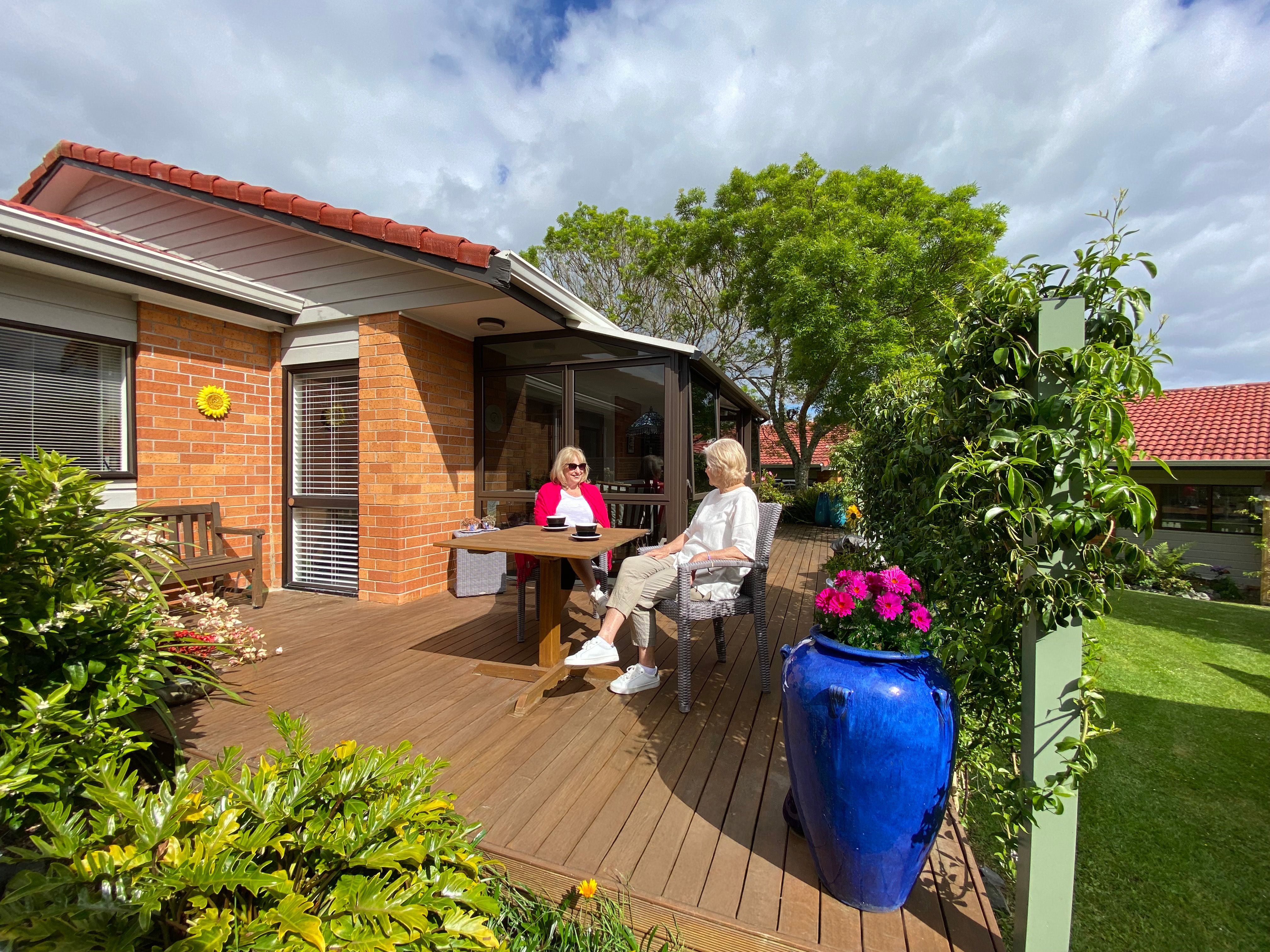 Residents sitting on their deck in the sun