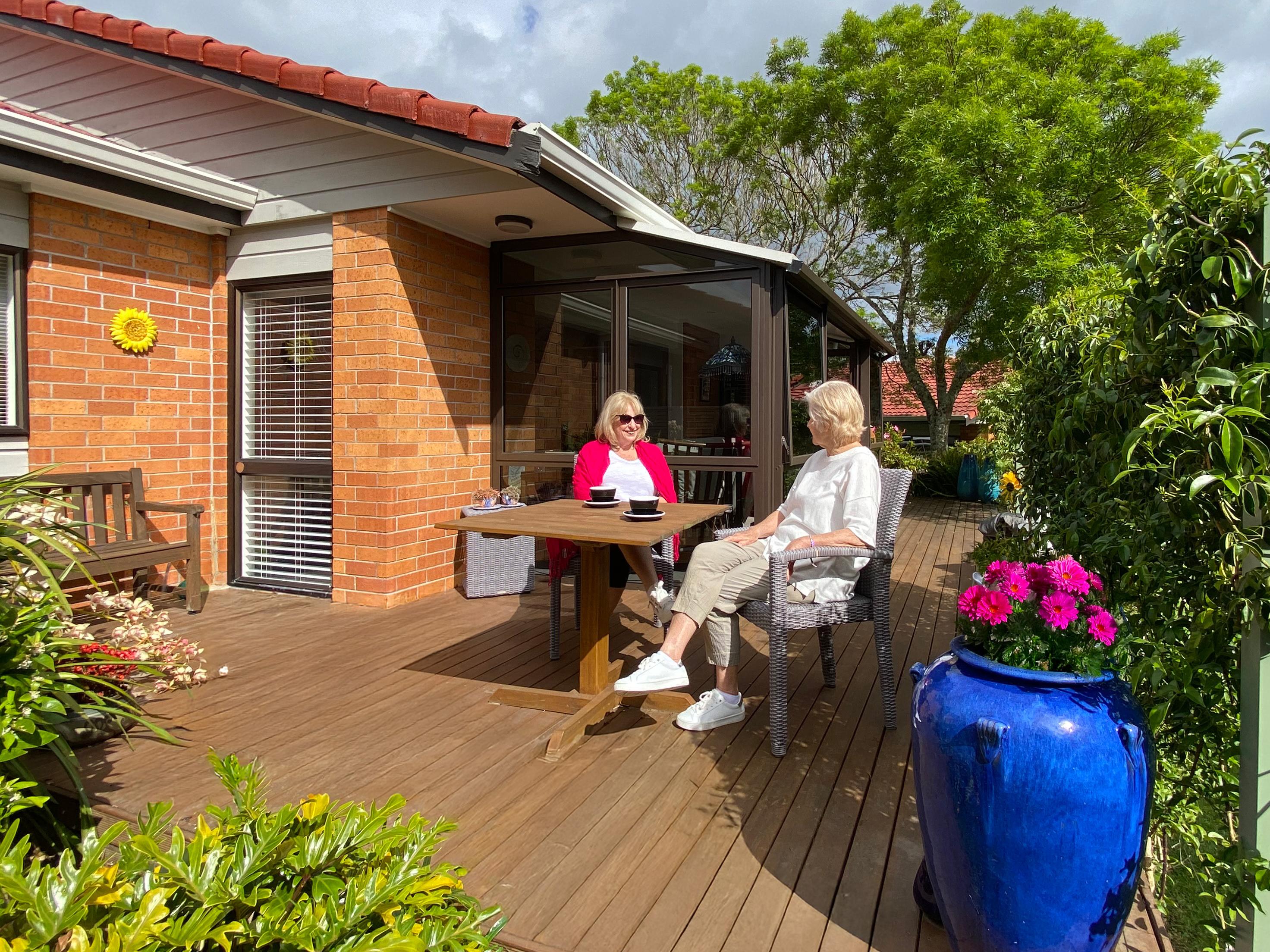 Residents sitting on their deck in the sun