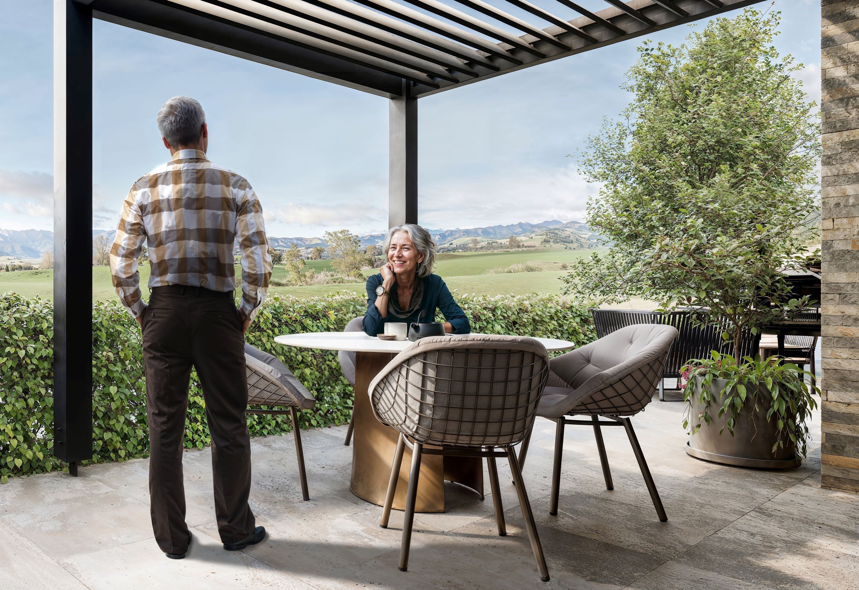 Residents sitting out on their patio at Otau Ridge