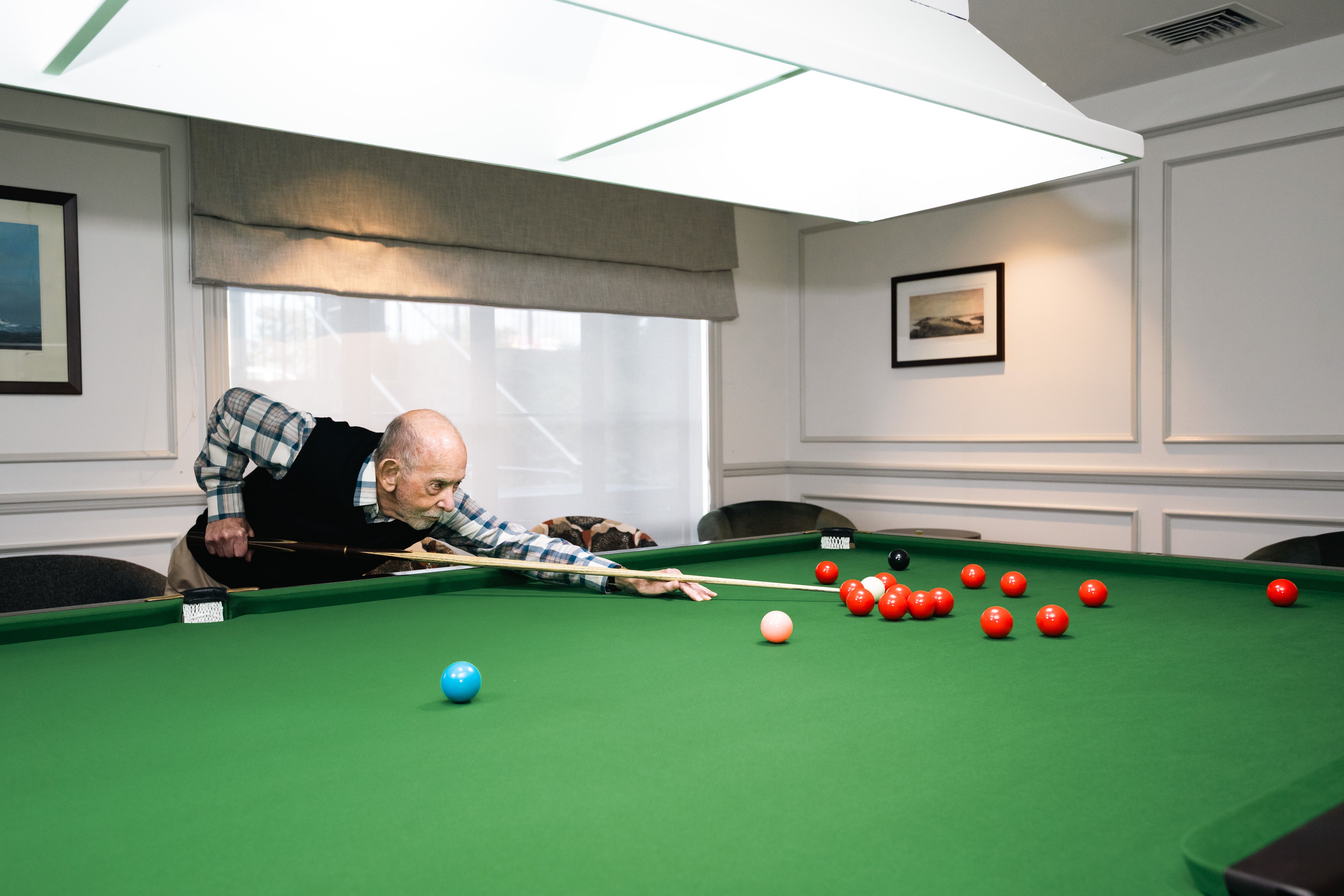 Resident playing pool