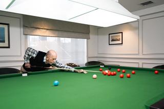 Resident playing pool
