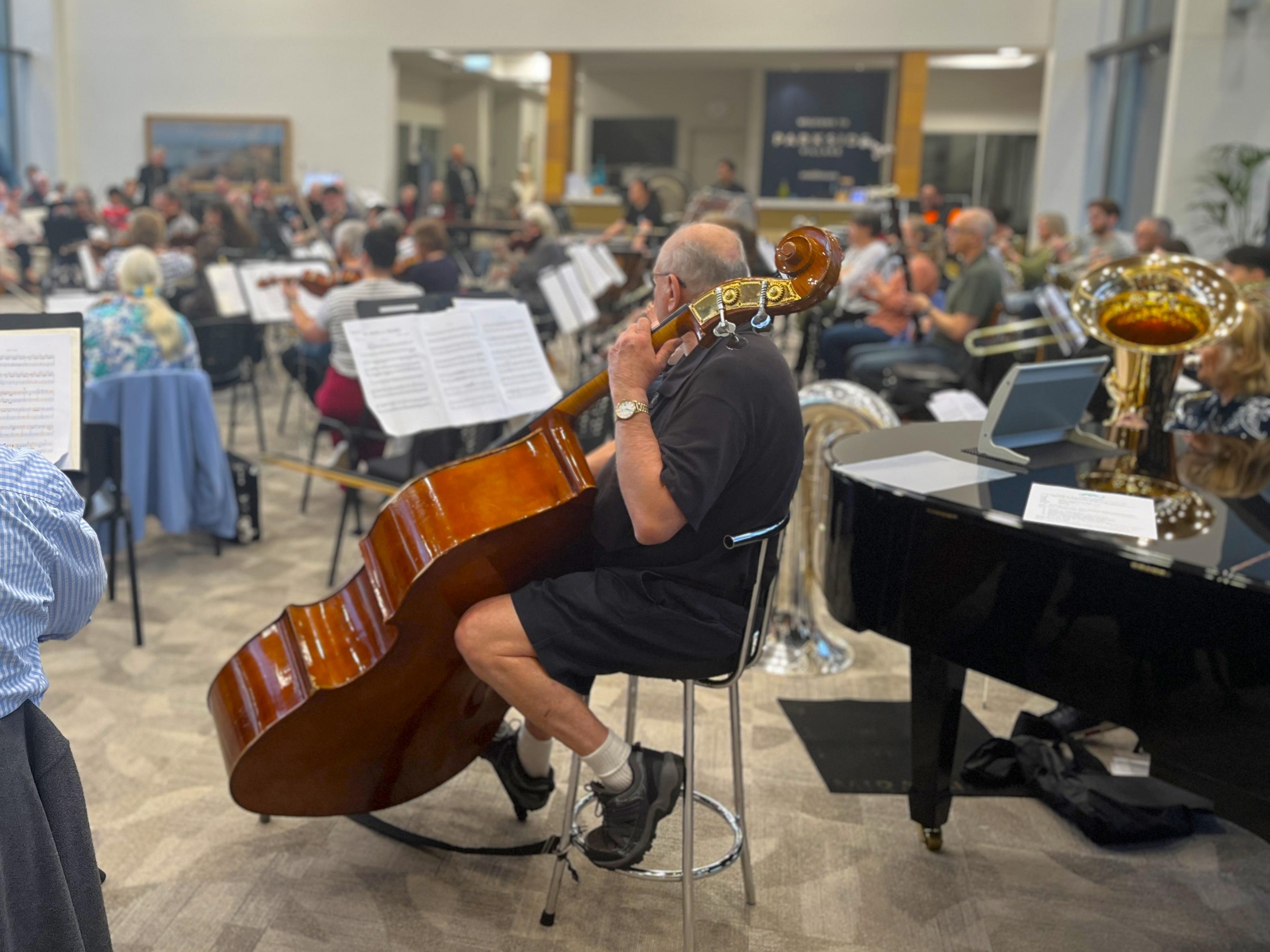 Symphony orchestra rehearses at Parkside Village