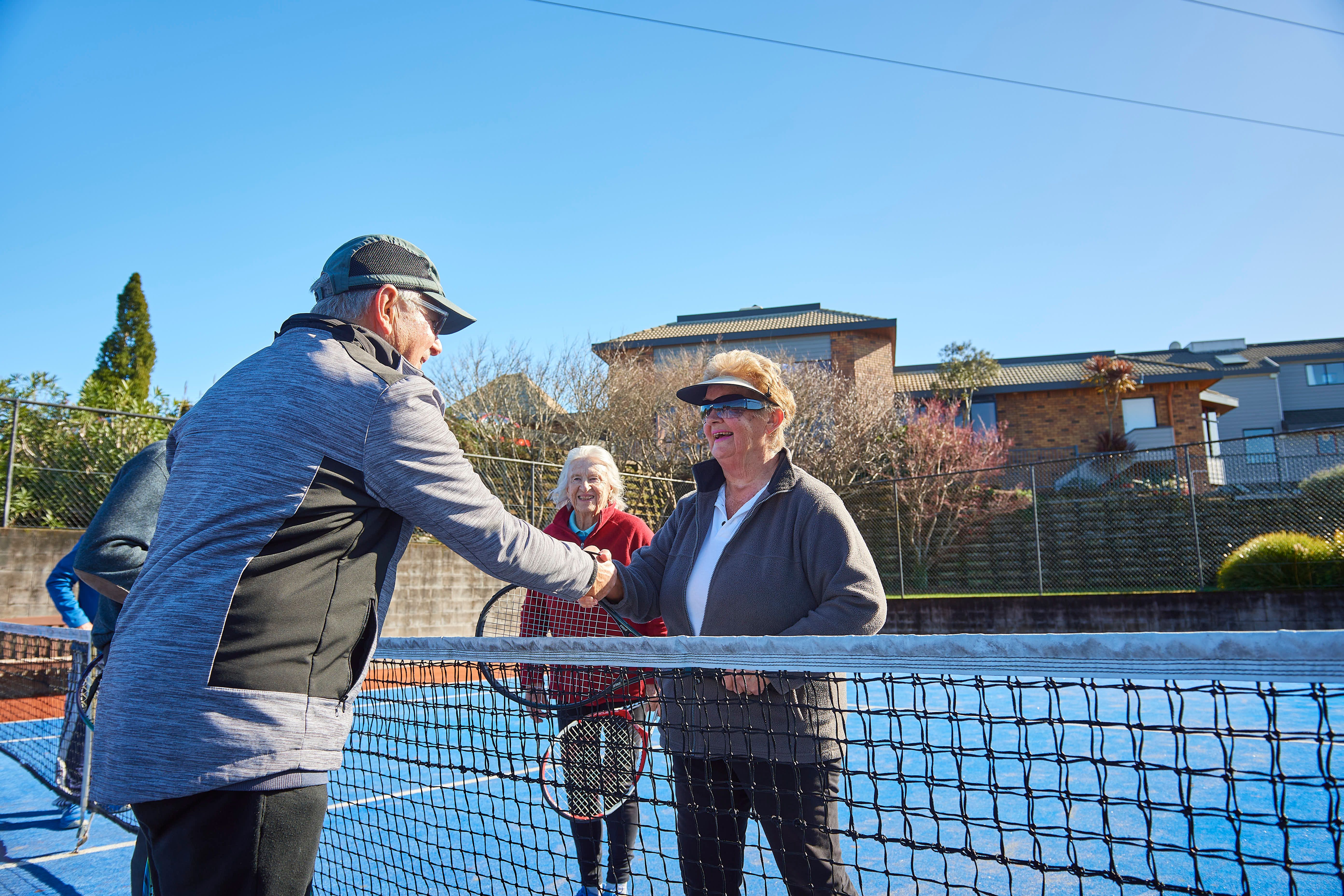 Residents playing tennis