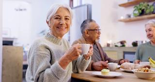 Lady smiling drinking her coffee