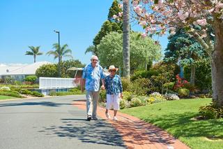Resident holding hands and walking