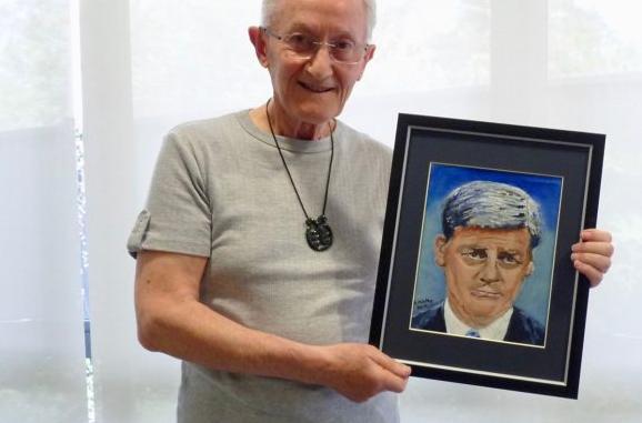 Raoul Ketko with one of his portraits