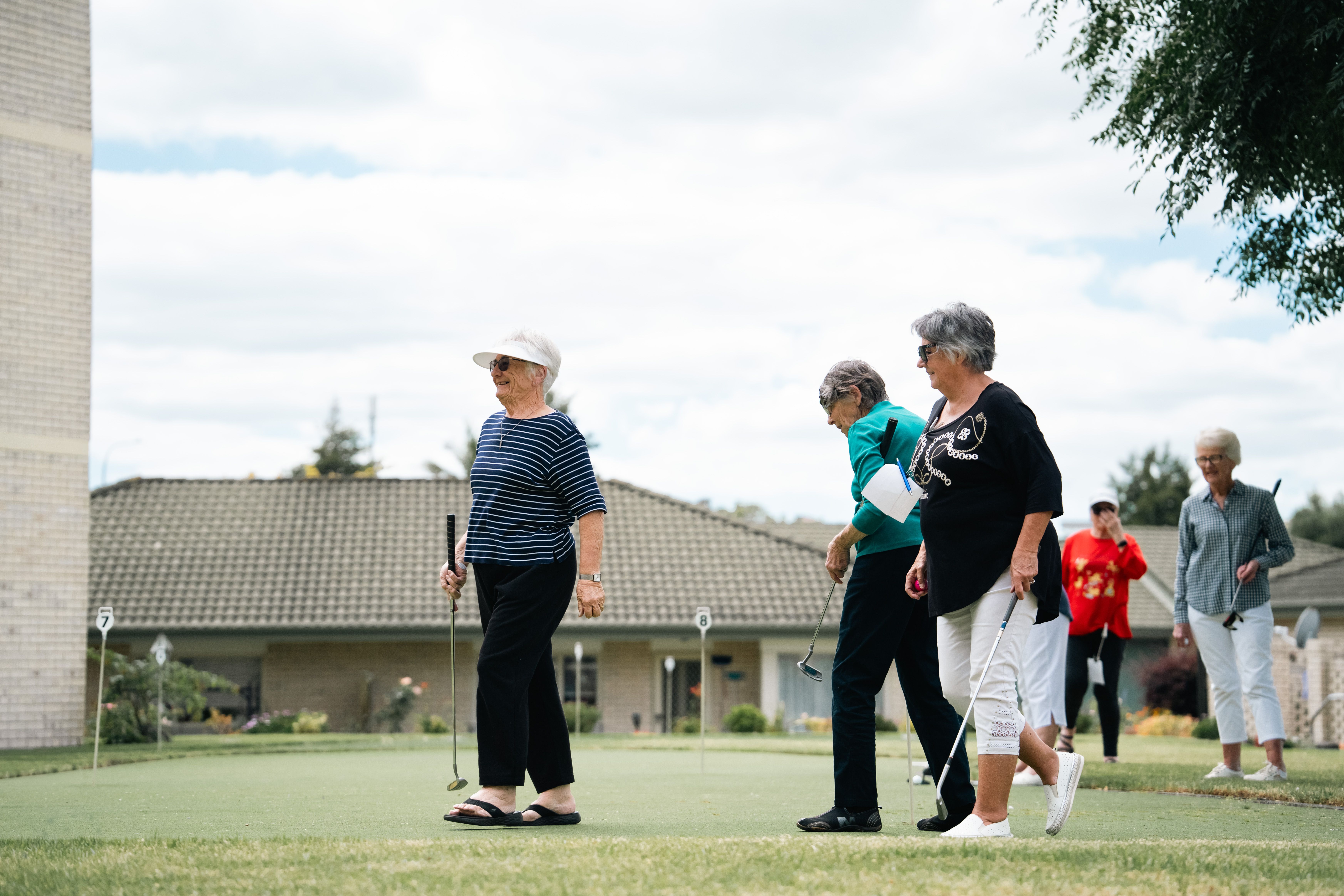 Residents doing putting on the village green