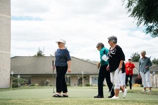 Residents doing putting on the village green