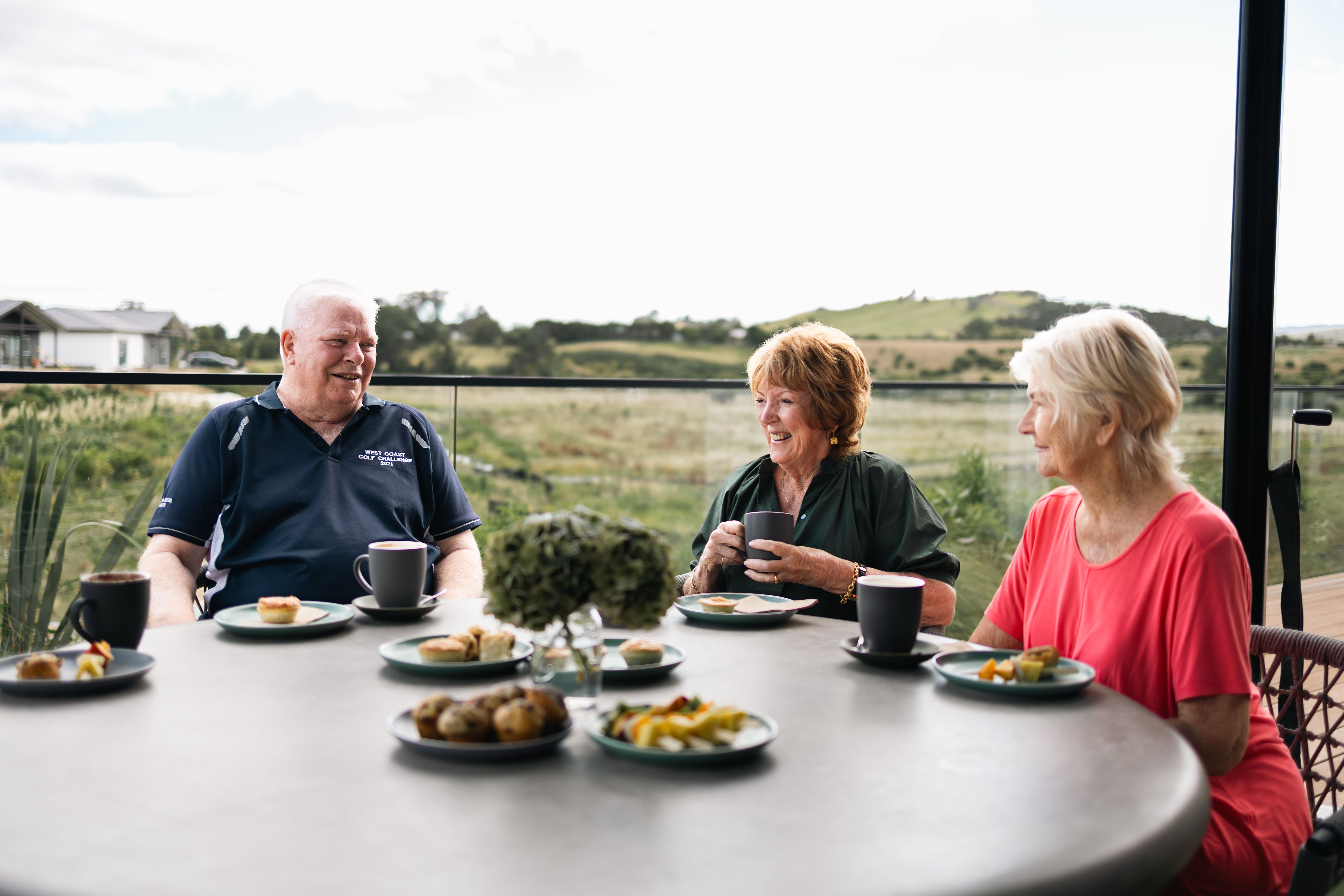 Residents enjoying lunch on the deck at Otau Ridge Village