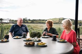Residents enjoying lunch on the deck at Otau Ridge Village