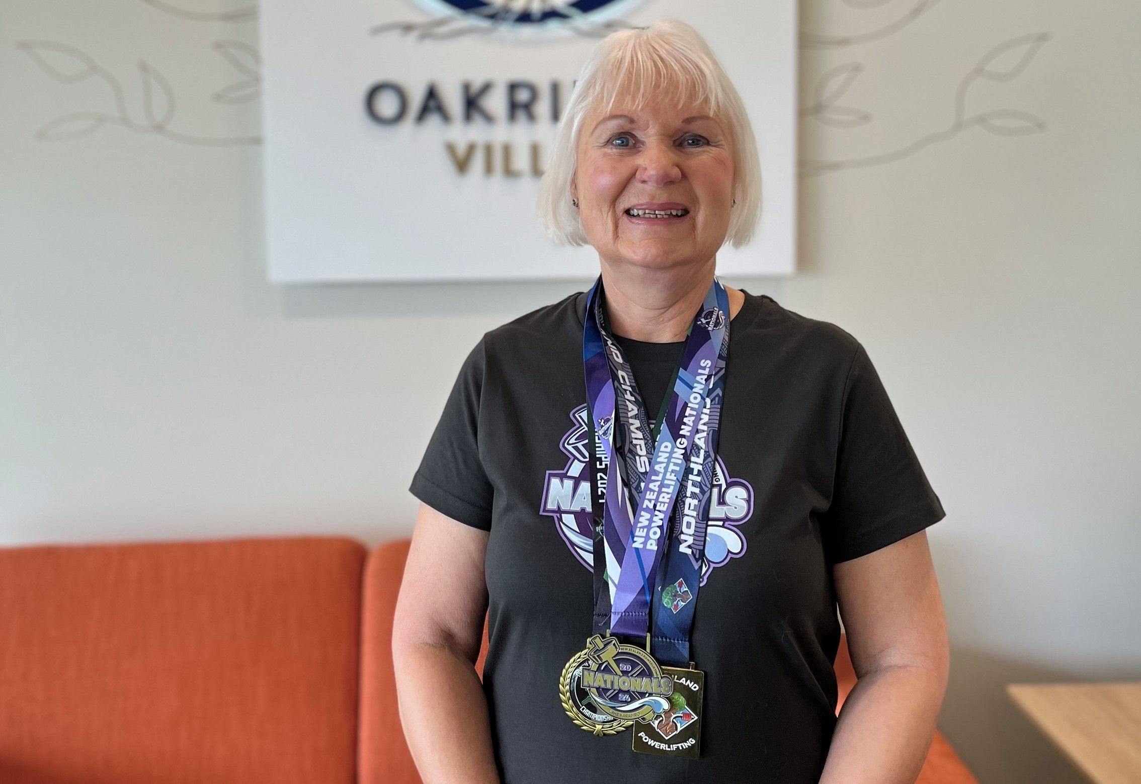 Susan with her powerlifting medals