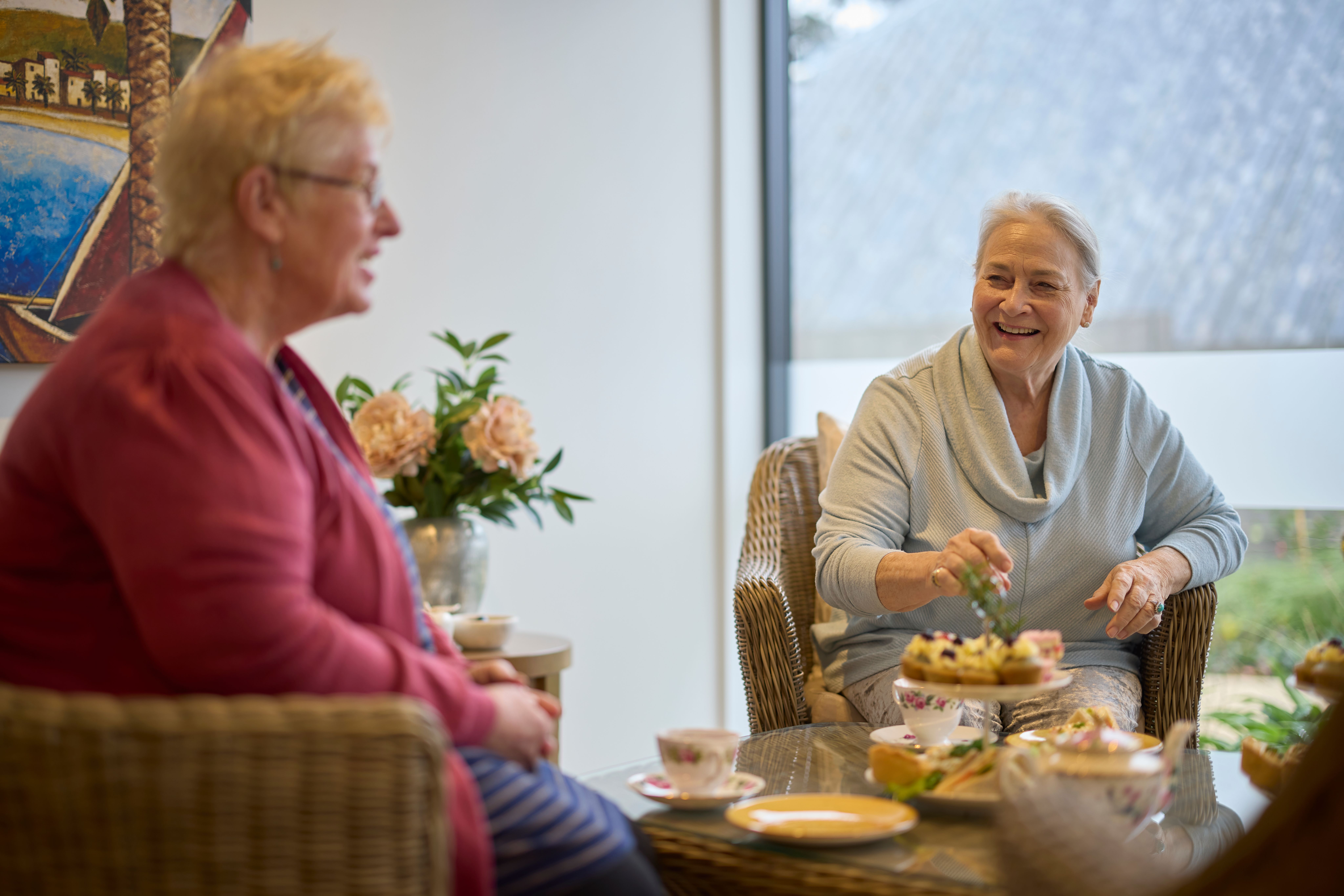 Happy residents having tea
