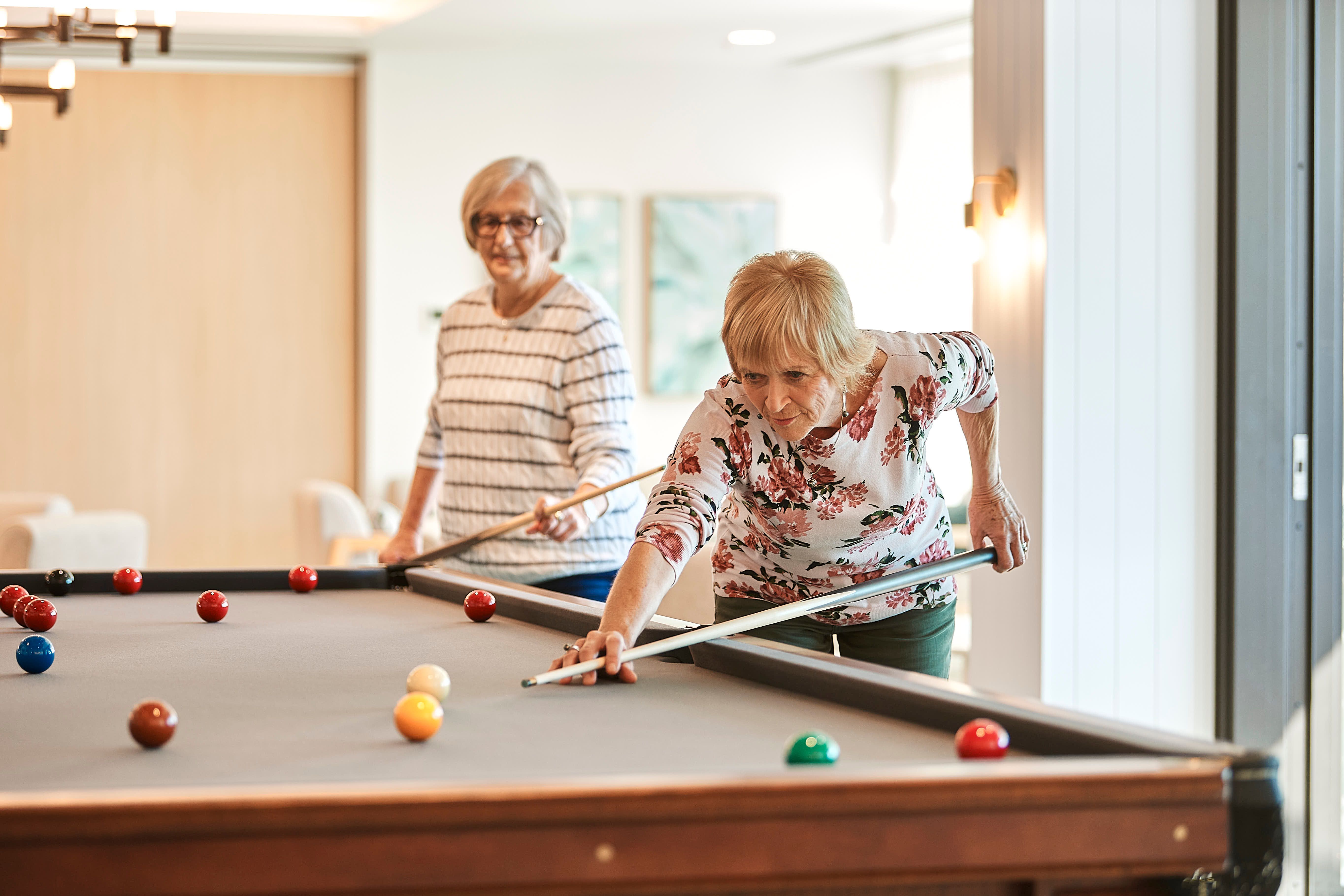 Friends playing pool