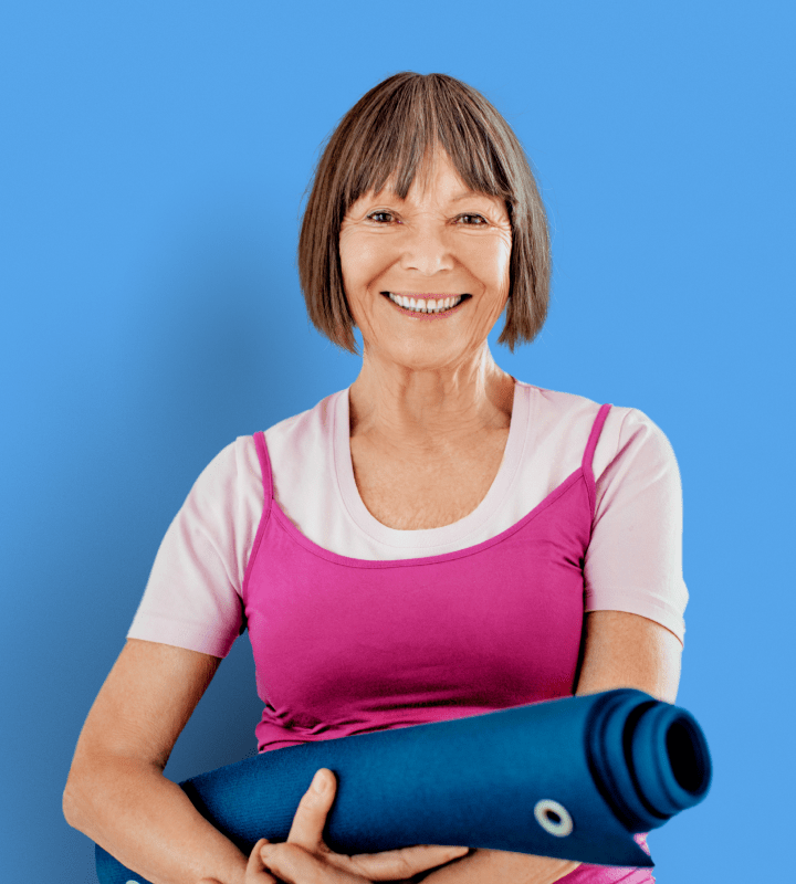 Lady with yoga mat on blue