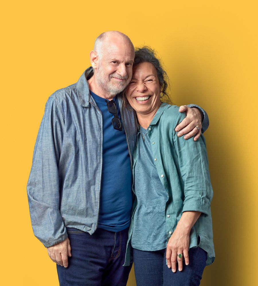 Retired couple on a yellow background