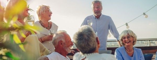 Friends socialising drinking wine